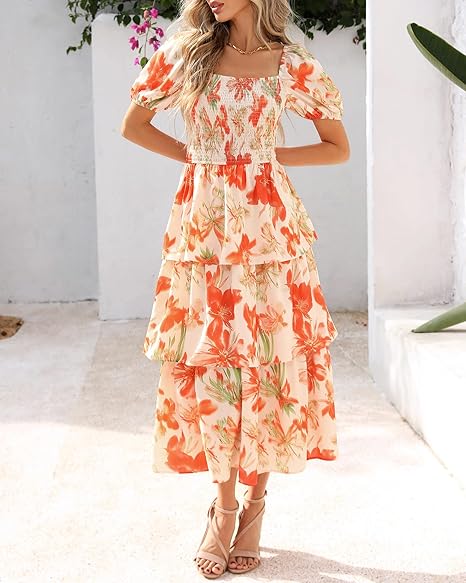 Arenzza women's floral square neck puff short sleeve smocked tiered dress displayed on a hanger, showcasing its vibrant floral pattern.