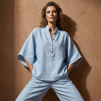 Aarenza women's stand-up collar top and wide-leg pants set in stylish fabric, displayed on a hanger.