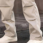 A pair of Arenzza men's multi-pocket straight-leg cargo pants showing multiple functional pockets and a relaxed fit.