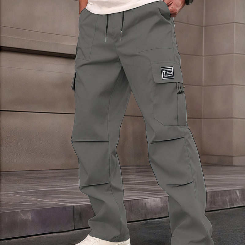A pair of men's Arenzza cargo pants with multiple pockets, straight-leg style, in a neutral color, displayed on a hanger.