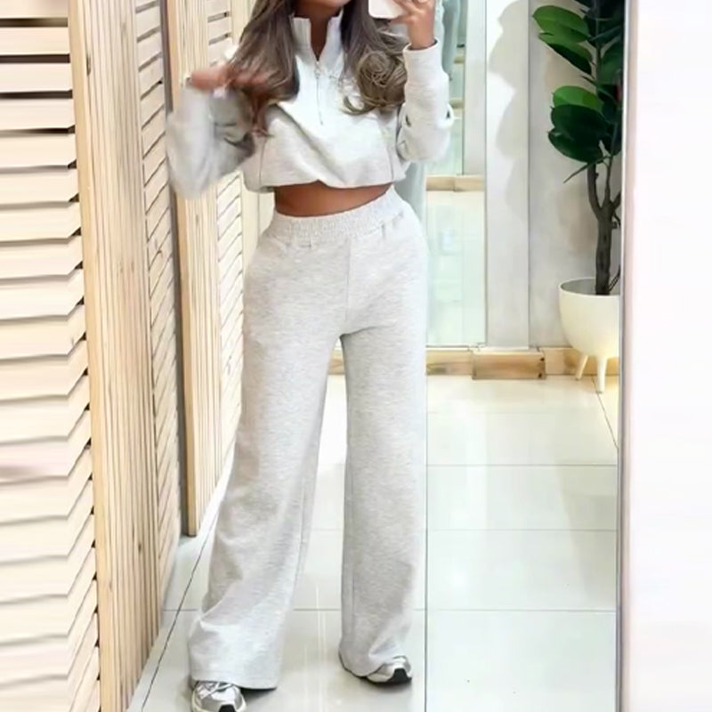A woman wearing a stylish Arenzza women’s pullover top and high waist pants set, showcasing a comfortable and trendy clothing outfit.