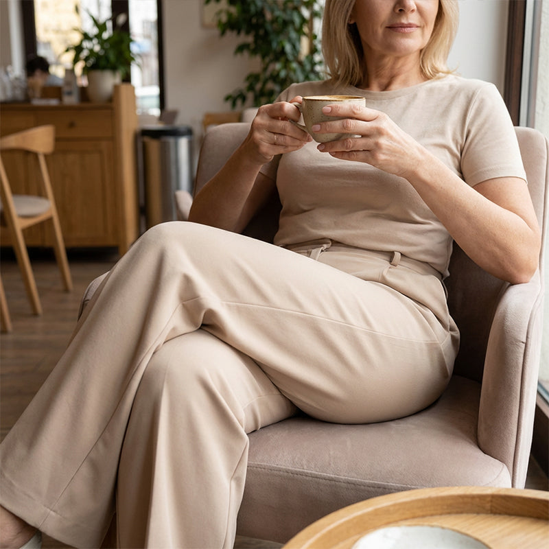 Women's high-waist wide-leg solid color trousers by Arenzza, shown in a neutral tone, with a relaxed fit and clean design.