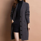 A women's long V-neck knit cardigan with pockets in a neutral color, stylish and cozy from Arenzza.