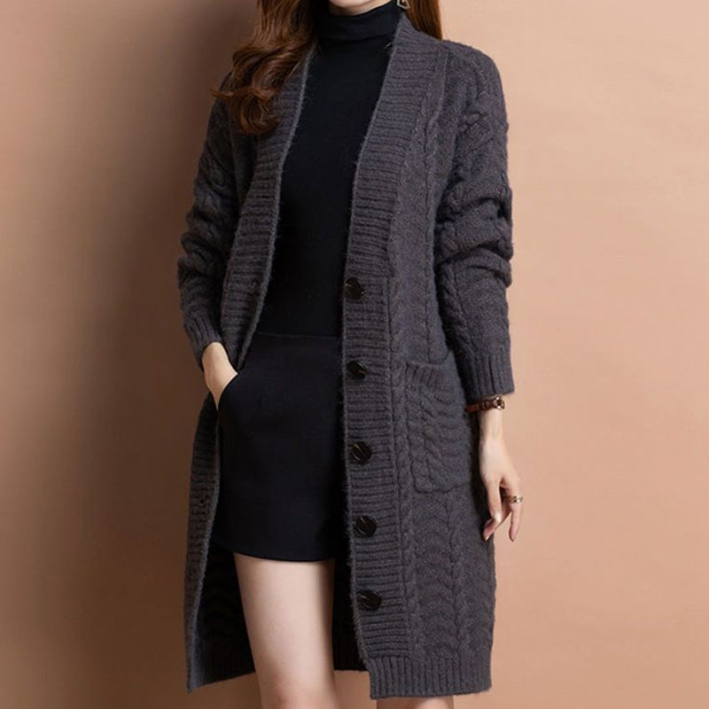 A women's long V-neck knit cardigan with pockets in a neutral color, stylish and cozy from Arenzza.