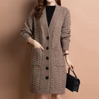 Women's long V-neck knit cardigan with pockets by Arenzza, featuring a cozy, textured fabric and a relaxed fit.