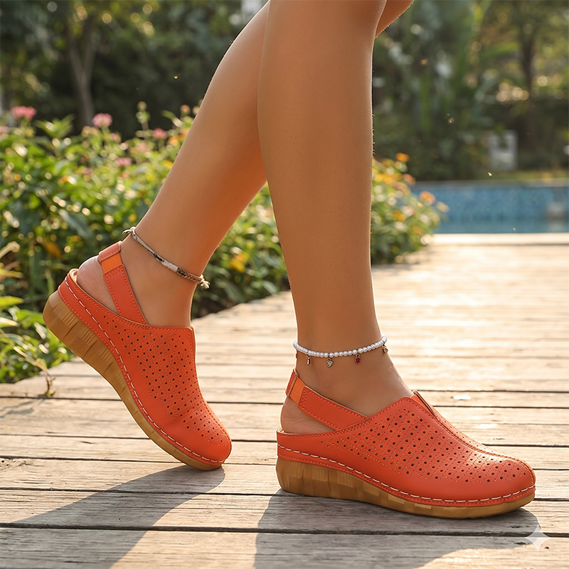 A pair of Arenzza women's casual perforated wedge slingback sandals with open toes and adjustable straps.