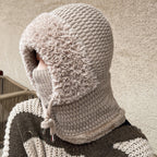 A woman wearing the Arenzza 3-in-1 winter balaclava, showing its versatile design for cold weather protection and warmth.