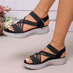 A pair of Arenzza women's elastic strap platform sport sandals with thick soles and open toes, ideal for all-day comfort.
