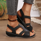 A pair of Arenzza summer rhinestone wedge sandals for women with open toes and stylish straps, perfect for warm weather.