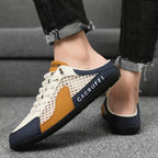 A pair of Arenzza men's breathable mesh slip-on slippers with open-toe design and soft fabric for comfortable casual wear.