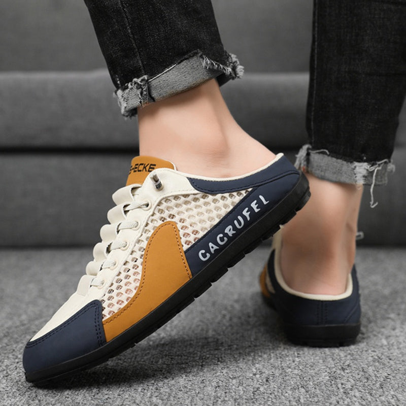 A pair of Arenzza men's breathable mesh slip-on slippers with open-toe design and soft fabric for comfortable casual wear.