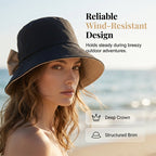 Arenzza women's wide brim sun hat with bowknot design, foldable for 360° sun protection, stylish summer accessory.