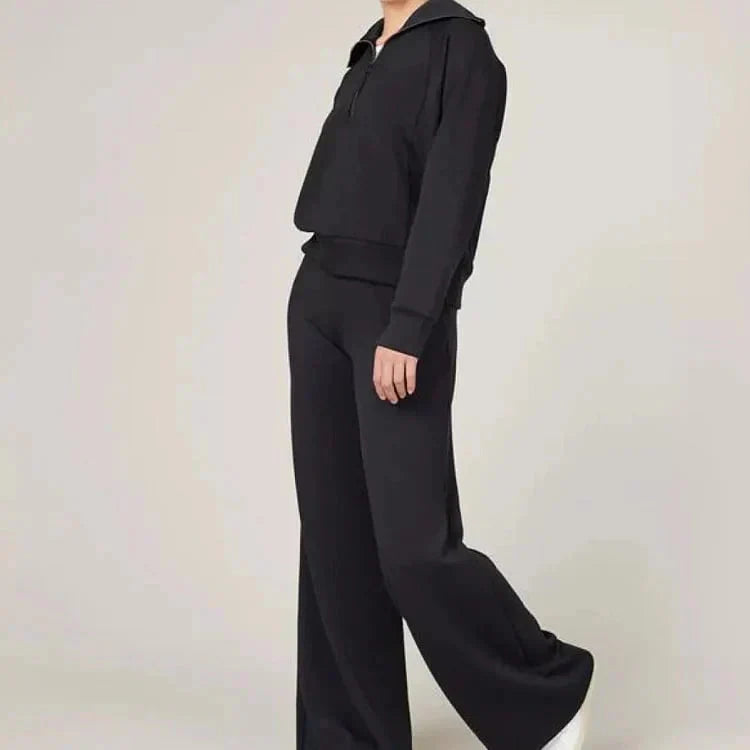 A woman wearing Arenzza women's 2-piece casual sweatsuit set, comfortable clothing for leisure and everyday wear.