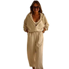 A woman wearing a casual Arenzza hooded jumpsuit with long sleeves and a relaxed fit, front view, stylish and comfortable clothing.