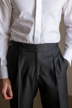 Men's solid color straight casual trousers by Arenzza, shown in a neutral tone, displayed flat with waistband and pockets visible.