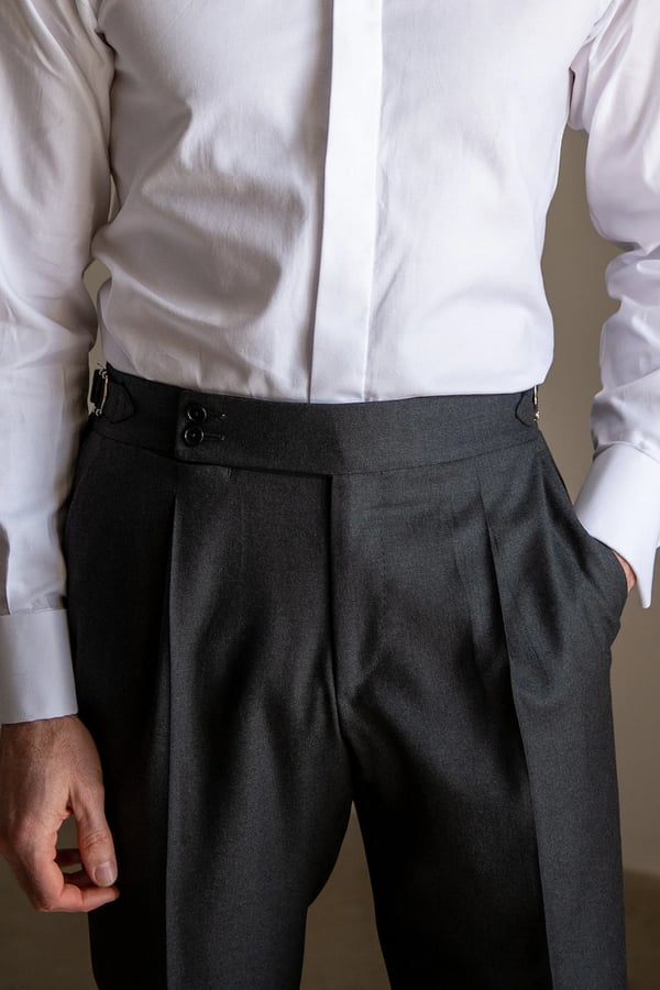 Men's solid color straight casual trousers by Arenzza, shown in a neutral tone, displayed flat with waistband and pockets visible.