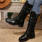 Women's vintage combat boots with laces and buckle detail from Arenzza, featuring a rugged leather design and sturdy sole.