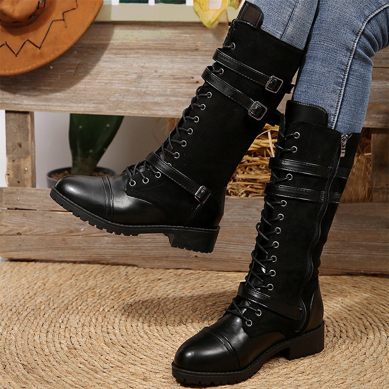 Women's vintage combat boots with laces and buckle detail from Arenzza, featuring a rugged leather design and sturdy sole.