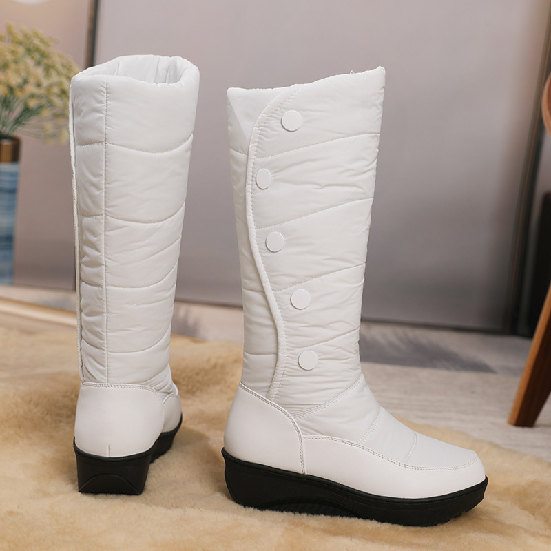 A pair of women's Arenzza waterproof knee-high snow boots with warm lining, suitable for winter outdoor wear.
