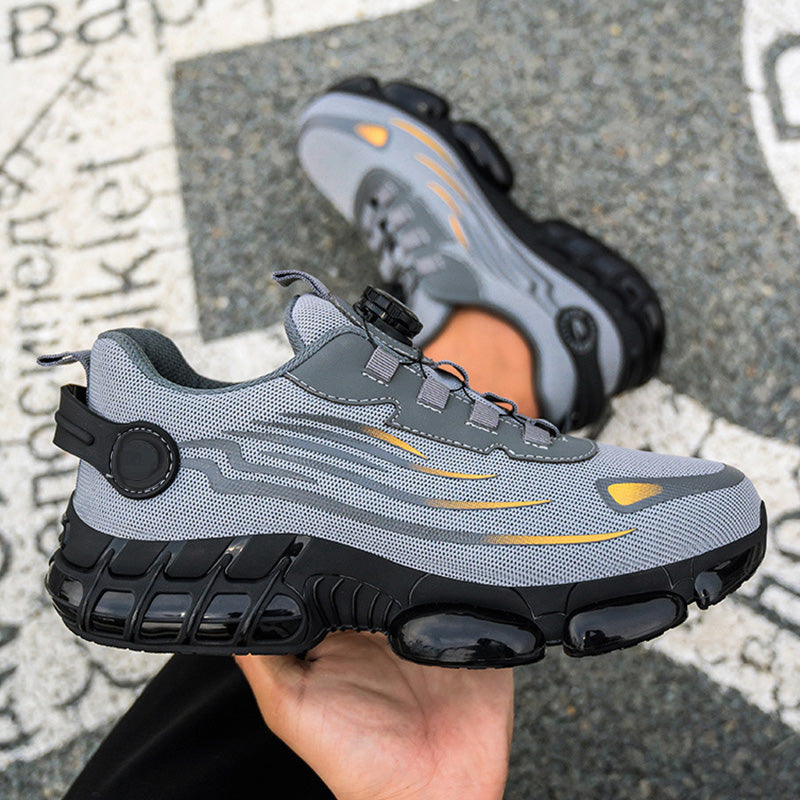 A pair of Arenzza non-slip safety shoes with shock-absorbing studs, designed for durable and secure footwear.
