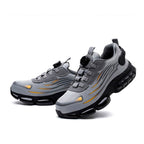 A pair of Arenzza non-slip safety shoes with shock-absorbing studs, designed for workplace safety and comfort.