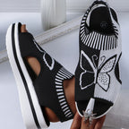 A pair of Arenzza women's casual peep-toe platform beach sandals with woven straps and a sturdy sole, perfect for summer outings.