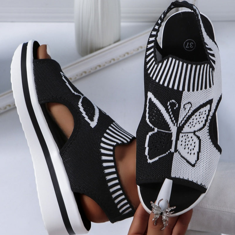 A pair of Arenzza women's casual peep-toe platform beach sandals with woven straps and a sturdy sole, perfect for summer outings.