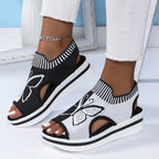 A pair of Arenzza women's casual peep-toe platform beach sandals with open toes and chunky soles, perfect for summer outings.