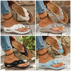 A pair of Arenzza women's floral wedge thong sandals with floral accents, cushioned arch support, and a non-slip outsole.