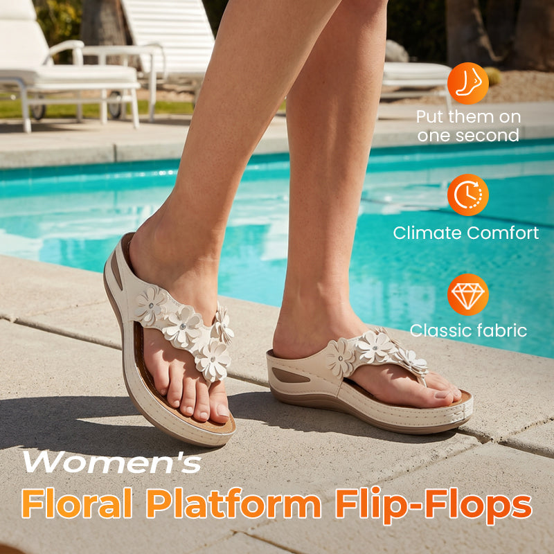 Women's floral wedge thong sandals by Arenzza with cushioned arch support, floral accents, and non-slip outsole.