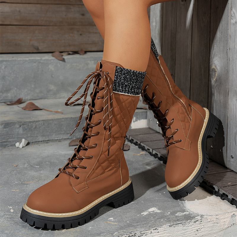 Women's Arenzza quilted mid-calf winter boots with side zipper, showcasing a cozy, insulated design for cold weather.