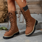 A pair of women's Arenzza quilted mid-calf winter boots with side zippers and cozy insulation for cold weather.