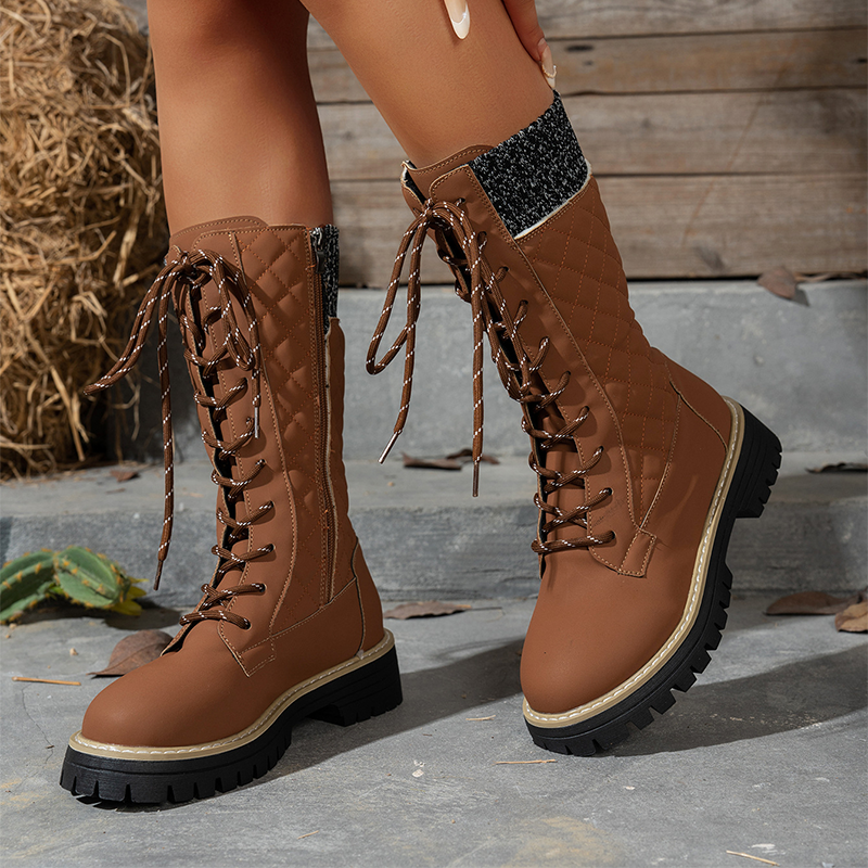 A pair of women's Arenzza quilted mid-calf winter boots with side zippers and cozy insulation for cold weather.