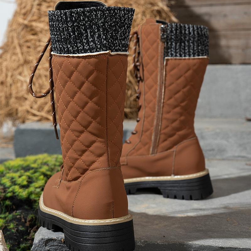 Women's quilted mid-calf winter boots with side zipper by Arenzza, featuring a cozy padded design and sturdy soles.