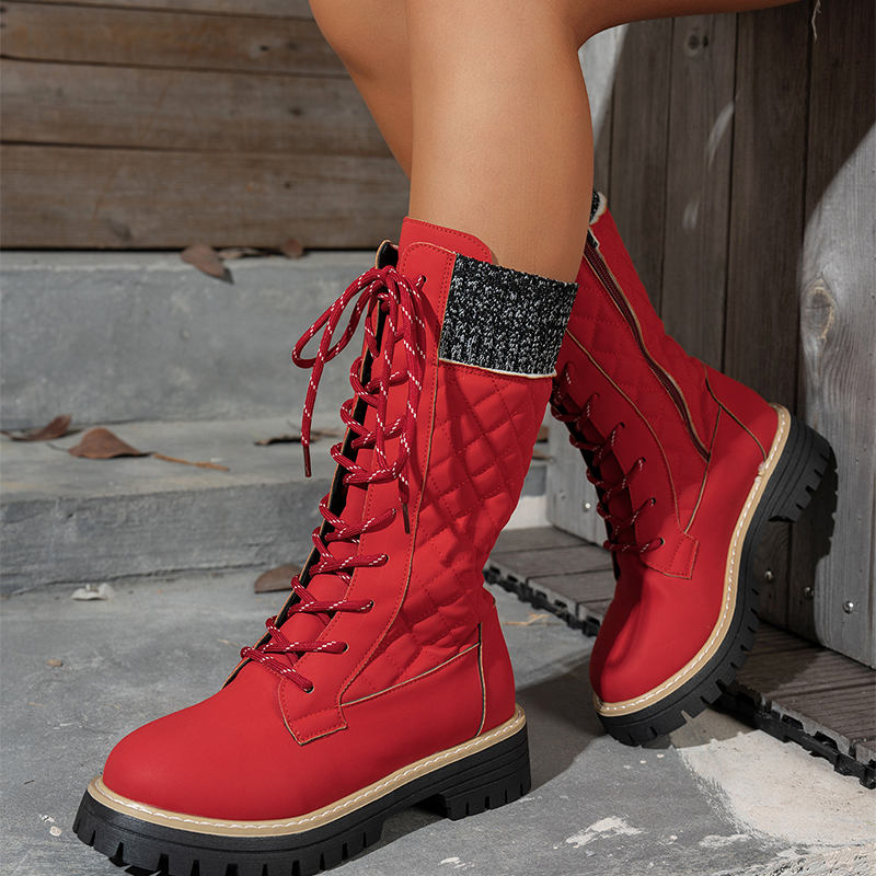 A pair of women's quilted mid-calf winter boots with side zippers from Arenzza, featuring a warm, padded design for cold weather.