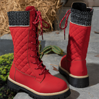 A pair of women's Arenzza quilted mid-calf winter boots with side zippers, featuring a cozy, insulated design for cold weather.