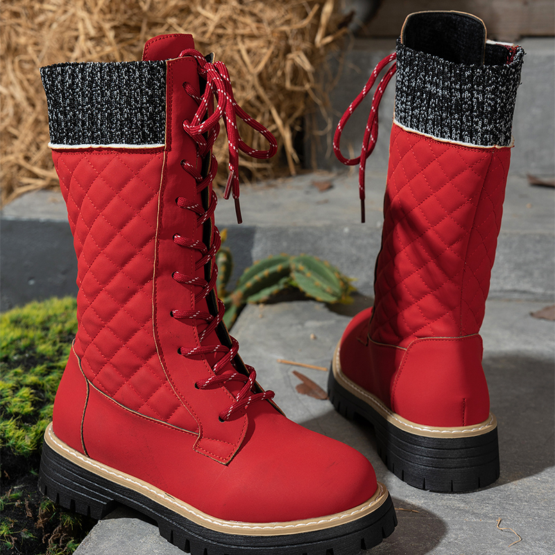 A pair of women's Arenzza quilted mid-calf winter boots with side zippers, featuring a cozy, insulated design for cold weather.