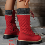 A pair of women's Arenzza quilted mid-calf winter boots with side zippers, featuring a padded winter design and durable sole.