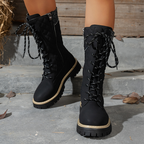 Women's quilted mid-calf winter boots with side zipper by Arenzza, showcasing their padded design and side zipper detail.