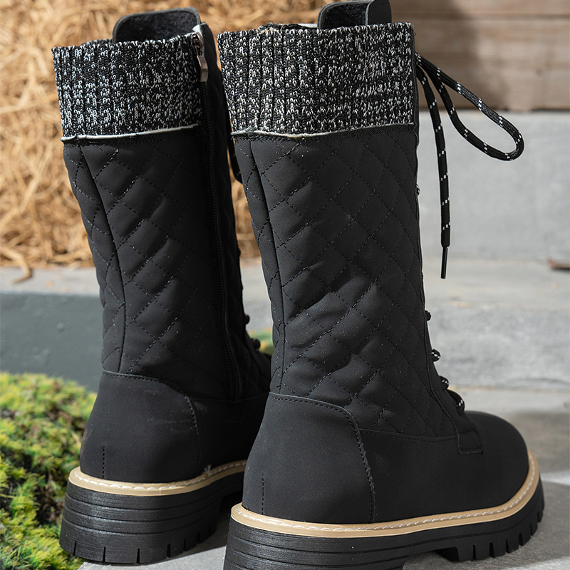 A pair of Arenzza women's quilted mid-calf winter boots with side zippers, showing the stylish exterior and side detail.