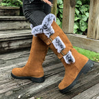 A pair of Arenzza women's thick plush mid-calf snow boots with cozy fur lining and sturdy soles for winter wear.