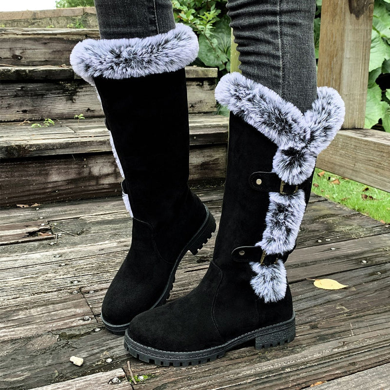 A pair of women's thick plush mid-calf snow boots by Arenzza with warm lining and waterproof design for winter wear.