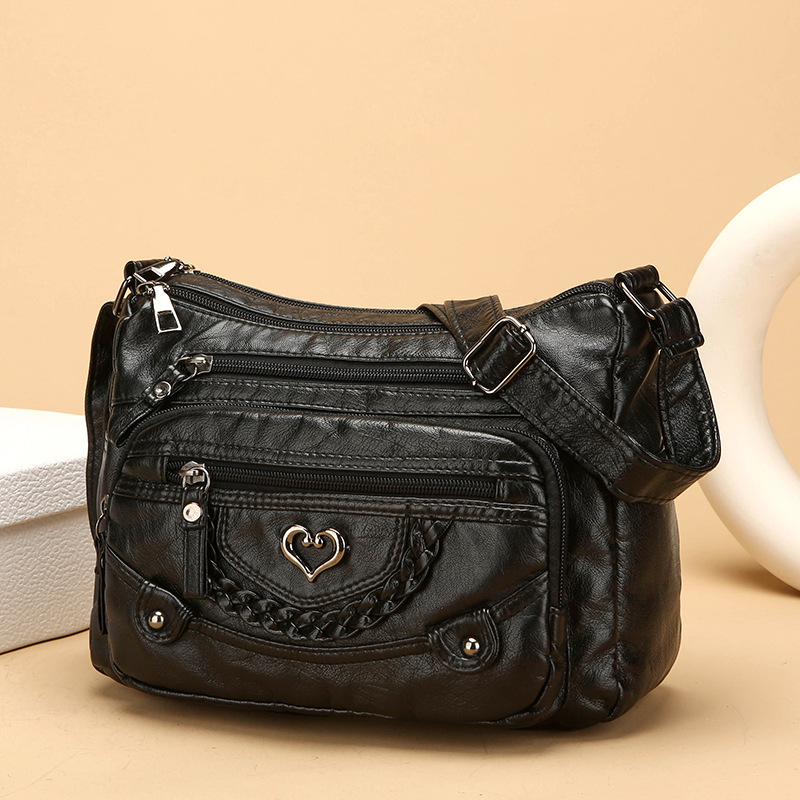 Aarenzza women's soft PU leather crossbody bag with multiple pockets, shown in black with adjustable strap on a plain background.