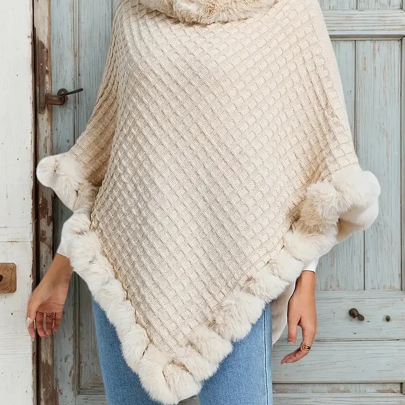 A woman wearing the Arenzza women's chic ultra-warm faux fur trim knit shawl, showcasing its cozy, stylish design and soft texture.