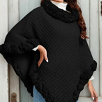 A woman wearing a chic, ultra-warm knit shawl with faux fur trim by Arenzza, designed for stylish winter warmth.