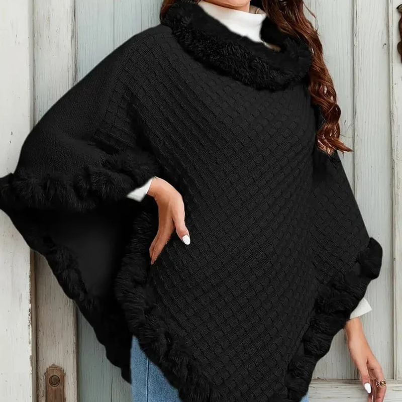 A woman wearing a chic, ultra-warm knit shawl with faux fur trim by Arenzza, designed for stylish winter warmth.