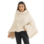 A woman wearing Arenzza women's knit shawl with faux fur trim, showcasing its ultra-warm, stylish design and cozy texture.