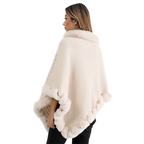 Aarenza women's chic ultra-warm faux fur trim knit shawl draped over a neutral background, showcasing its cozy knit and luxurious fur detail.