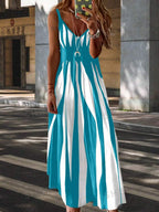 Aarenza LUNE Printed Maxi Cami Dress displayed on a hanger, showcasing a flowy fabric with vibrant printed patterns.