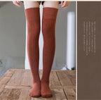 A pair of warm black thigh-high socks or long stockings by Arenzza, shown laid flat for clothing and accessory styling.